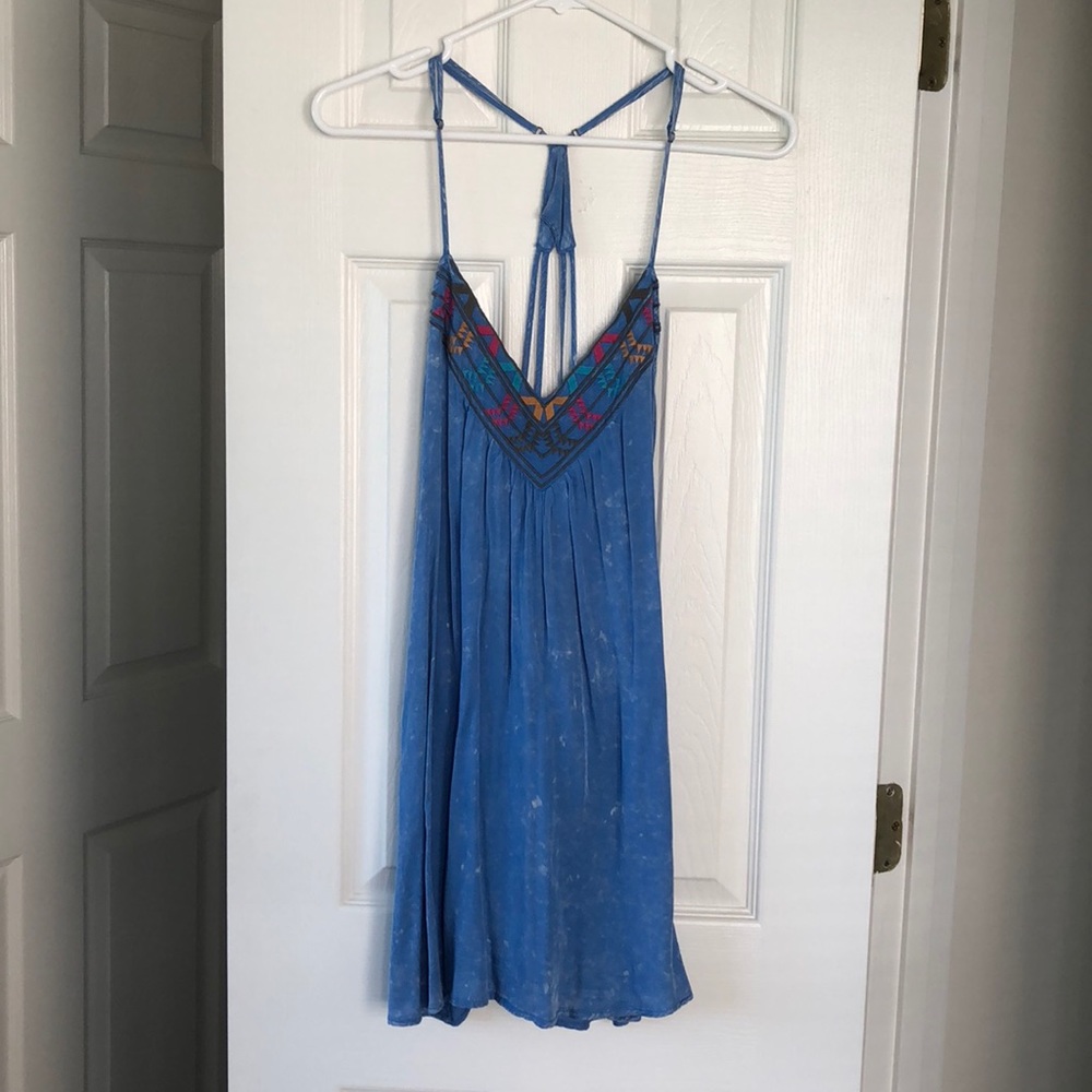 En Creme blue dress with a strappy back